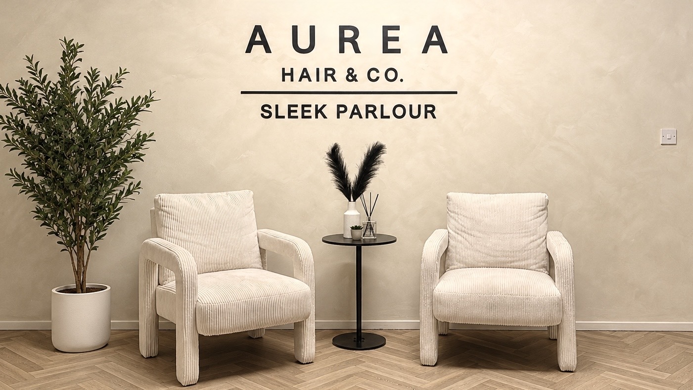 Beauty studio interior with warm wood, neutral finishes and arched mirrors